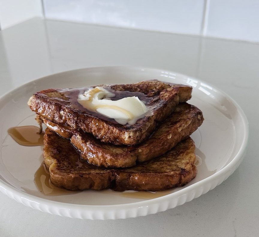 French toast breakfast shared by a family on a quiet birthday morning